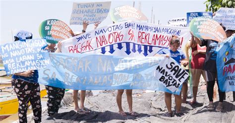 Navotas fisherfolk rally against demolition and reclamation to save .